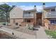 Charming townhome exterior with a cozy balcony and well-maintained landscaping at 3332 S Ammons St # 103, Lakewood, CO 80227