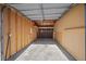 Spacious unfinished garage interior with ample room for parking and storage opportunities at 3332 S Ammons St # 103, Lakewood, CO 80227