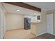 Bright kitchen with stainless steel appliances, wood flooring and white cabinets at 3332 S Ammons St # 103, Lakewood, CO 80227