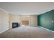 Inviting living room with a fireplace, neutral carpet, and sliding door access to the outside at 3332 S Ammons St # 103, Lakewood, CO 80227