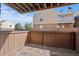 Private outdoor patio features a fence for seclusion and relaxing open-air space at 3332 S Ammons St # 103, Lakewood, CO 80227