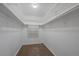 Spacious walk-in closet offers ample storage with shelves and hanging rods for organization at 3332 S Ammons St # 103, Lakewood, CO 80227