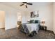 Comfortable bedroom featuring a ceiling fan and artwork above the bed at 7833 Bandit Dr, Castle Rock, CO 80108