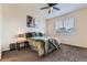 Bedroom featuring a ceiling fan, natural light, and a comfortable bed at 7833 Bandit Dr, Castle Rock, CO 80108