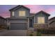 Two-story home boasts a modern exterior, complemented by a two-car garage and appealing landscaping at 7833 Bandit Dr, Castle Rock, CO 80108