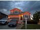 Beautiful home exterior with holiday lights, well-manicured lawn, and driveway at 7833 Bandit Dr, Castle Rock, CO 80108