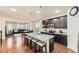 Spacious kitchen featuring granite countertops, a large island with seating, and stainless steel appliances at 7833 Bandit Dr, Castle Rock, CO 80108
