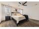 The primary bedroom features lots of natural light, and a comfortable bed at 7833 Bandit Dr, Castle Rock, CO 80108