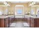 Luxurious bathroom with double vanity sinks and an elegant soaking tub at 311 Portmeirion Ln, Castle Rock, CO 80104