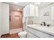 Beautifully updated bathroom featuring a tiled walk-in shower, modern vanity, and ample storage at 311 Portmeirion Ln, Castle Rock, CO 80104