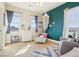 Charming bedroom with three windows, carpeted floors, and colorful decor at 311 Portmeirion Ln, Castle Rock, CO 80104