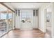 Bright dining area with custom built in cabinets, hardwood floors and sliding glass doors at 311 Portmeirion Ln, Castle Rock, CO 80104