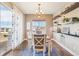 Bright dining room featuring a chandelier, a large window, and modern decor at 311 Portmeirion Ln, Castle Rock, CO 80104