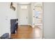 Bright entryway with hardwood floors, storage shelves and coat rack by the front door at 311 Portmeirion Ln, Castle Rock, CO 80104