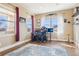 Functional home office featuring large windows, neutral walls, and comfortable workspace at 311 Portmeirion Ln, Castle Rock, CO 80104