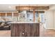 Open concept kitchen area showcasing a granite countertop and decorative wood beams at 311 Portmeirion Ln, Castle Rock, CO 80104