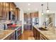 Modern kitchen boasting granite countertops, stainless steel appliances, and stylish backsplash at 311 Portmeirion Ln, Castle Rock, CO 80104