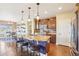 Elegant kitchen with a center island, stylish pendant lights, and stainless steel appliances at 311 Portmeirion Ln, Castle Rock, CO 80104