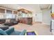 Spacious living room area featuring an entertainment area, and adjacent bar seating at 311 Portmeirion Ln, Castle Rock, CO 80104