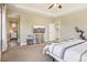Spacious main bedroom with a ceiling fan and adjacent doors at 311 Portmeirion Ln, Castle Rock, CO 80104