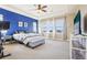 Bright and spacious main bedroom with a tray ceiling and plenty of natural light at 311 Portmeirion Ln, Castle Rock, CO 80104