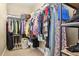 Organized walk-in closet with ample hanging space and shelving for storage at 311 Portmeirion Ln, Castle Rock, CO 80104