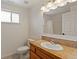 Bright bathroom with light wood vanity and neutral colored walls at 5425 County Road 32 # 14, Mead, CO 80504