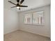 Cozy bedroom with neutral carpet, large window, and ceiling fan at 5425 County Road 32 # 14, Mead, CO 80504