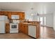 Well-equipped kitchen featuring appliances, tile floor, and an open layout at 5425 County Road 32 # 14, Mead, CO 80504