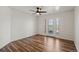 Bright living room with ceiling fan and sliding glass doors to the outside at 5425 County Road 32 # 14, Mead, CO 80504