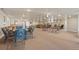 Expansive community meeting room featuring tables, chairs, ceiling fans, and neutral carpeting at 5425 County Road 32 # 14, Mead, CO 80504