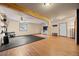 Large bonus room with wood floors, bright windows, and workout area at 9239 Black Mountain Dr, Conifer, CO 80433