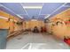 Organized garage space with ample storage and a designated area for tools and equipment at 9239 Black Mountain Dr, Conifer, CO 80433