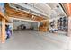 Spacious garage area offering ample storage and parking, complemented by exposed wood beams at 9239 Black Mountain Dr, Conifer, CO 80433