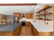 Gourmet kitchen with custom wood cabinetry, stainless steel appliances, and bright countertops at 9239 Black Mountain Dr, Conifer, CO 80433