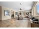 Open living room with tile flooring, sitting area, wood burning stove and scenic outdoor views at 9239 Black Mountain Dr, Conifer, CO 80433