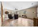 Spacious living room with tile floors, comfortable seating, and large windows with views at 9239 Black Mountain Dr, Conifer, CO 80433