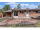 Exterior view of backyard featuring stone patio at 380 S Xanadu St, Aurora, CO 80012