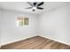 Clean, spacious bedroom with wood floors, a window, and a ceiling fan at 380 S Xanadu St, Aurora, CO 80012