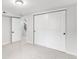 Bright bedroom with closet and access door to the hallway at 380 S Xanadu St, Aurora, CO 80012
