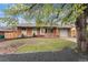 Charming brick home featuring a well-maintained lawn and inviting front entrance at 380 S Xanadu St, Aurora, CO 80012
