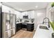 Modern kitchen featuring stainless steel appliances, sleek countertops, and ample cabinet space at 380 S Xanadu St, Aurora, CO 80012