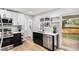 Modern kitchen featuring stainless steel appliances, sleek countertops, and ample cabinet space at 380 S Xanadu St, Aurora, CO 80012