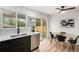 Bright kitchen boasts stainless steel appliances, backyard views, and stylish backsplash at 380 S Xanadu St, Aurora, CO 80012