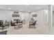 Spacious living room featuring neutral walls, carpet flooring, and stylish decor at 380 S Xanadu St, Aurora, CO 80012