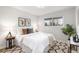 Inviting main bedroom with a large window, decorative pillows, and patterned rug at 380 S Xanadu St, Aurora, CO 80012