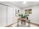 Cozy home office featuring a sleek desk, comfortable chair, and ample natural light from the window at 380 S Xanadu St, Aurora, CO 80012