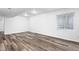 Finished basement featuring modern vinyl flooring and natural light at 3775 Balderas St, Brighton, CO 80601