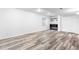 Finished basement featuring stylish wood flooring and contemporary shelving at 3775 Balderas St, Brighton, CO 80601
