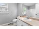 The half bathroom features natural light, a white sink, and tile floors at 3775 Balderas St, Brighton, CO 80601